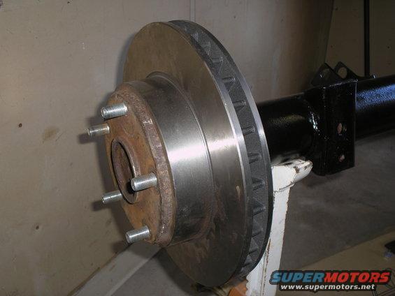 Axle assembly with brake rotor and studs