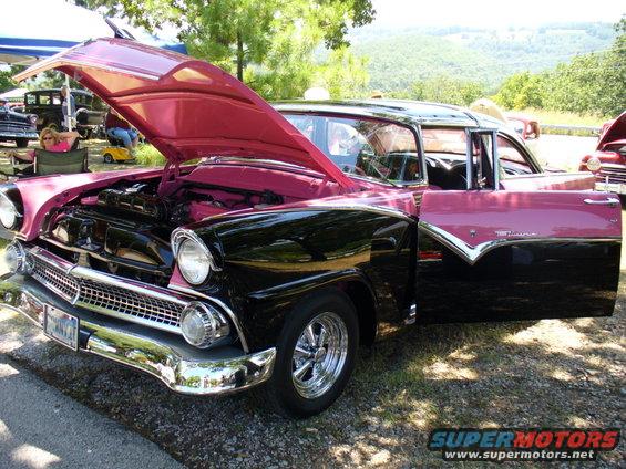 Two-tone pink and black 1956 Ford Fairlane with hood and driver's door open