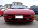1994 Ford Probe - Front view of a red 1994 Ford Probe, its distinctive headlights and Ford emblem. A Washington state license plate is visible.