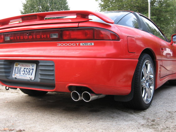 red 1991 Mitsubishi 3000GT VR-4 rear view with dual exhaust pipes and Virginia license plate