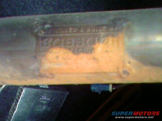 Vehicle identification plate with stamped numbers and text