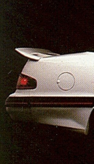White 1987 Ford Thunderbird rear quarter panel with spoiler and fuel door