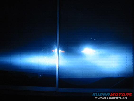 Headlights with blue tint, Supermotors.net logo visible