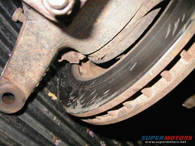 dscn5584.jpg I suppose previous owner thought hitting the brake rotor with a hammer was a good idea.