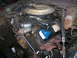 1978 Ford F-250 - The engine bay of a 1978 Ford F-250 shows the carburetor, distributor, and other engine components.