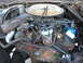 1978 Ford F-250 - The engine compartment of a 1978 Ford F-250 shows a V8 engine with its air cleaner and distributor visible.