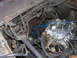 1978 Ford F-250 - Close-up view of a carburetor and engine bay components, with numerous hoses and wires visible.
