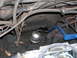 1978 Ford F-250 - Close-up view of the engine bay of a 1978 Ford F-250, showing various hoses, wires, and a fuel filter.