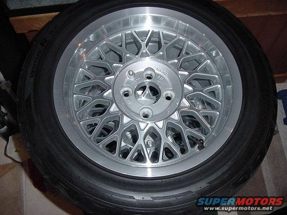 Silver mesh alloy wheel with black tire