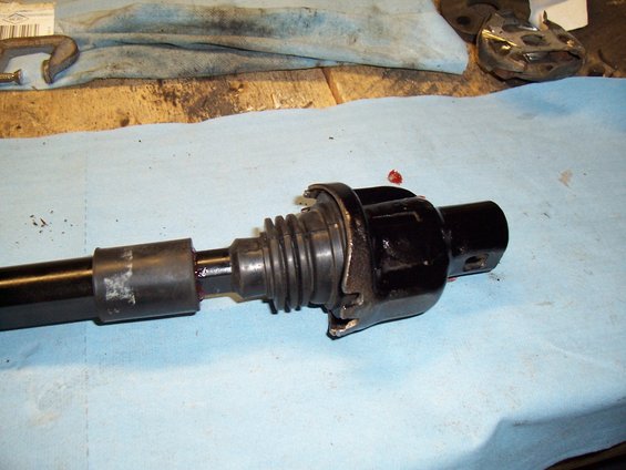 Black steering column part with rubber boot and metal housing