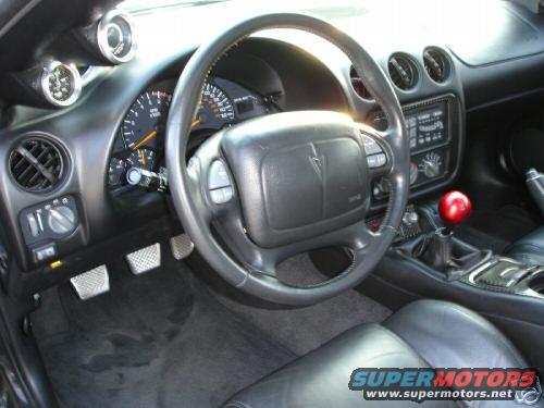 2002 Pontiac Trans Am interior showing dashboard, steering wheel, and shifter