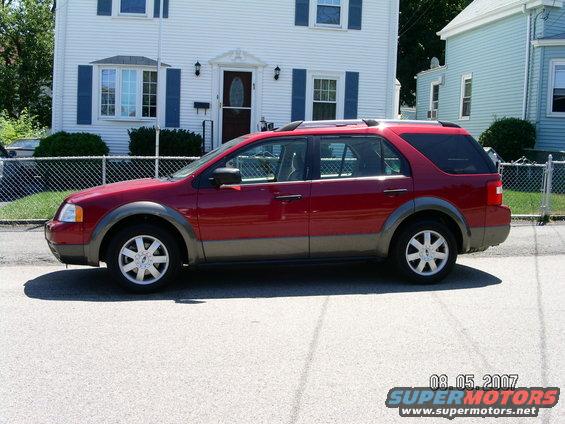 Side view of a red 2006 Ford Five Hundred SUV