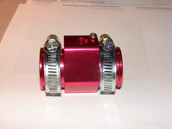 Red aluminum hose fitting with two hose clamps