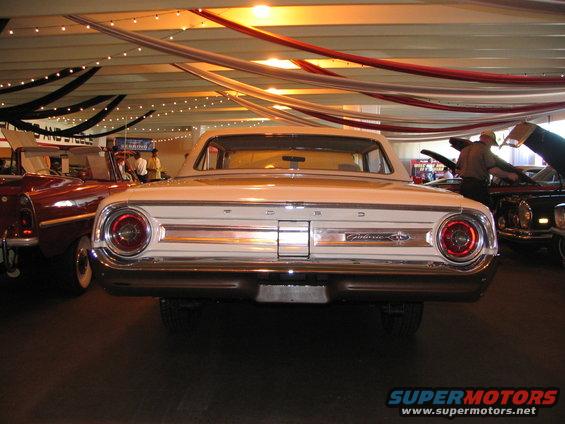 White 1962 Ford Galaxie rear view, chrome bumper, round taillights, "Galaxie" script on trunk lid