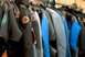 1992 Ford Bronco - A selection of wetsuits are displayed on hangers, ready for use.