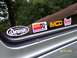 1996 Ford Bronco - Vehicle window displays multiple aftermarket performance and racing stickers, including K&N and Summit Racing Equipment.