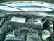 2002 Ford Explorer - The engine bay of a 2002 Ford Explorer is visible, displaying the 4.0L SOHC V6 engine.