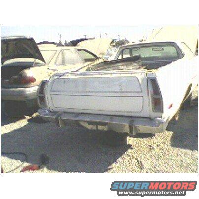 White 1973 Ford Ranchero rear view in a junkyard