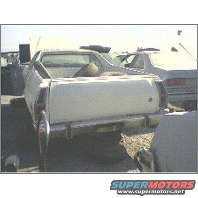 White 1973 Ford Ranchero rear view in a junkyard