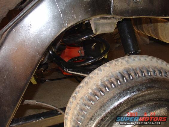 Here is the right way notice how it curv is turned toward the drum brake and not away.