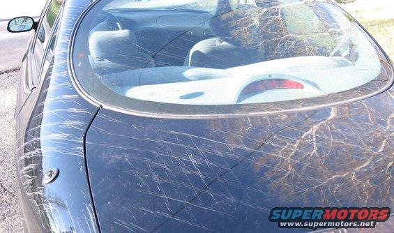 1999 Ford Taurus rear trunk and window heavily scratched