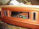 1977 Ford F-150 - The interior of a 1977 Ford F-150 shows its dashboard with wiring exposed in the radio opening.