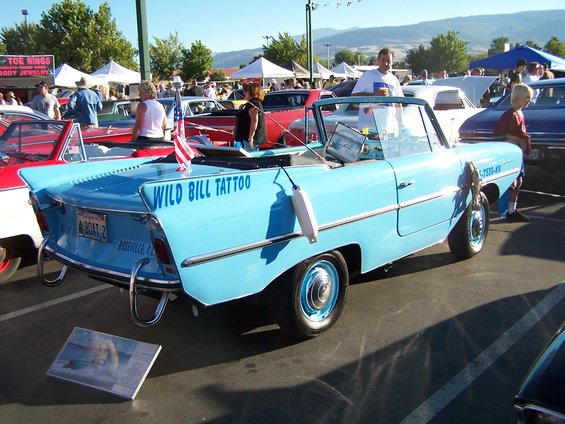 Blue amphibious car with 'WILD BILL TATTOO' on the side
