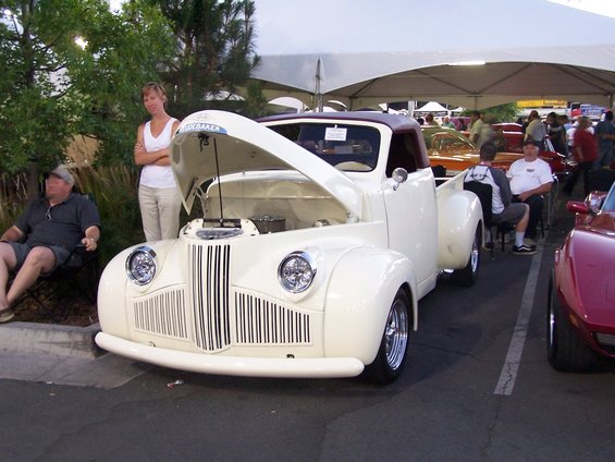 Cream-colored pickup truck with hood open, maroon roof, chrome grille, and aftermarket wheels