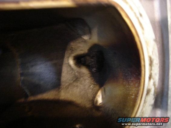 Engine cylinder with carbon buildup and visible valve seat