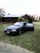 1989 Ford Mustang - This 1989 Ford Mustang is parked on a grassy lawn in front of a house, with both doors open.