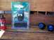 1994 Ford Probe - Collection of automotive parts, including an MSD ignition coil, a Deltran waterproof battery charger, and a pair of blue fog lights, displa…