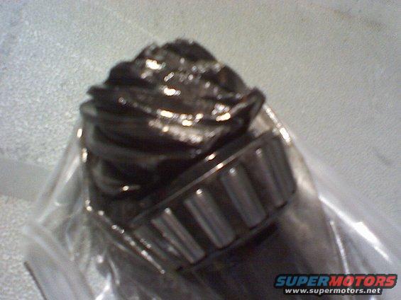 Worn differential gear and bearing in plastic packaging