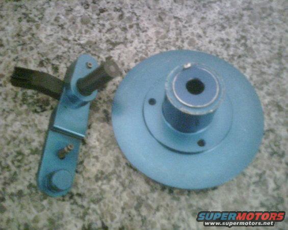 Blue painted automotive timing adjuster bracket and disc