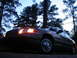 2000 Ford Crown Victoria - This 2000 Ford Crown Victoria is captured in a three-quarter front view as dusk settles, with its headlights illuminated.