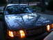 2000 Ford Crown Victoria - Front view of a 2000 Ford Crown Victoria with headlights on.