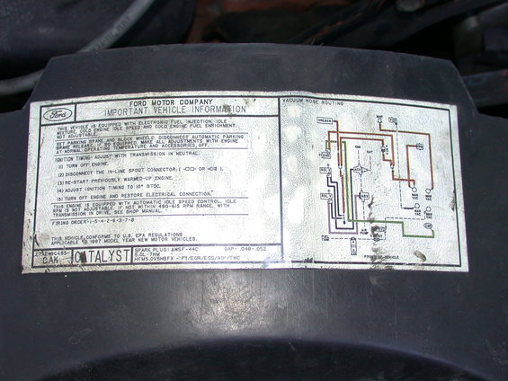 Ford engine sticker with vacuum hose routing diagram and important vehicle info. Says applicable to 1997 model year