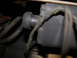 1987 Lincoln Town Car - Close-up of a vacuum hose connection, likely from an engine bay.