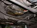 1987 Lincoln Town Car - Visible oil leaks on the underside of a vehicle, likely from the engine or transmission.