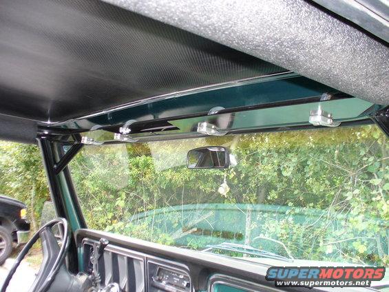 1978 Ford Bronco interior showing the headliner, visor clips, rearview mirror, and dashboard