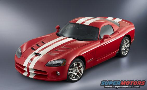Red sports car with dual white racing stripes, front 3/4 view. Hood vents visible