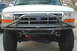 1991 Ford Bronco - Front view of a 1991 Ford Bronco a custom fabricated metal bumper over the stock grille.