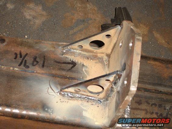 Welded metal brackets with measurements marked on them