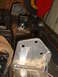 1989 Ford Bronco - Custom metal fabrication parts are being worked on in a garage setting.
