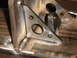 1989 Ford Bronco - Close-up of a metal bracket with multiple holes, likely for a custom rear bumper fabrication.