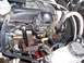 2003 Ford Ranger - Close-up view of a vehicle's engine compartment, showing intricate wiring and plumbing.
