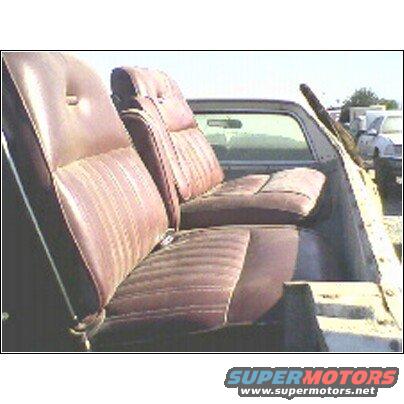 1973 Ford Ranchero interior showing front bench seat and rear jump seats in bed