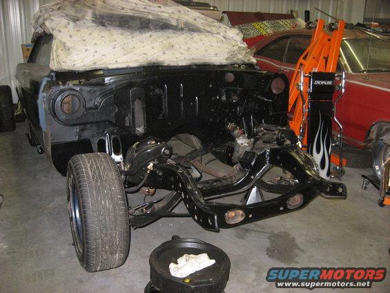 1965 Ford Galaxie front clip with engine removed, covered in a sheet