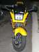 2002 Kawasaki Ninja - A yellow Kawasaki Ninja motorcycle is parked on the street, viewed from the front.