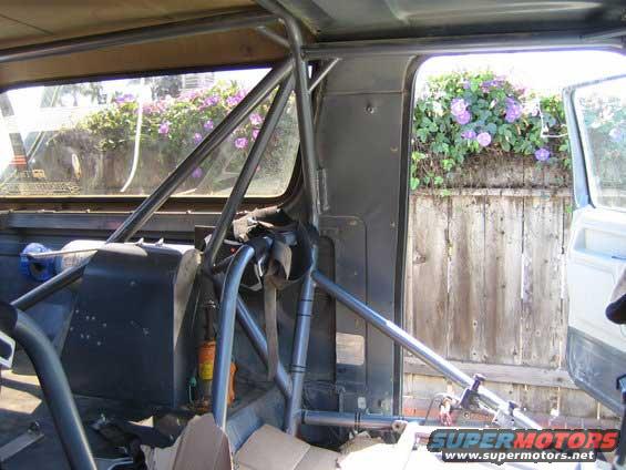 Interior of a vehicle with a roll cage and racing seat