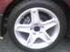 1990 Ford Bronco - Close-up of a vehicle's wheel and tire, with visible brake components.